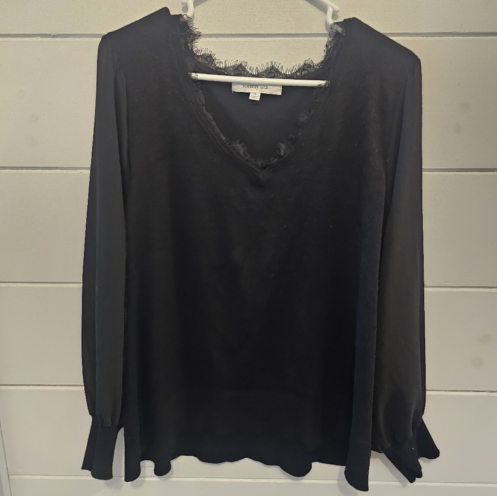 Cute dressy black top. Sheer sleeves.